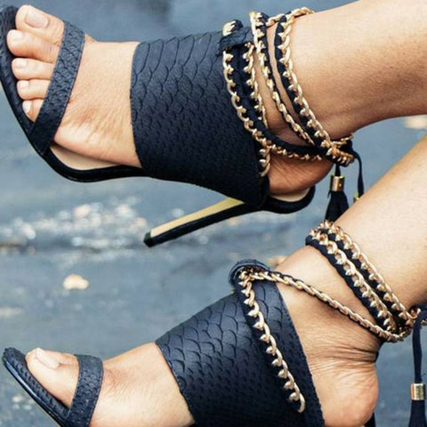 AZMODO Black Embossed Ankle Wrap Heel Sandals Black color